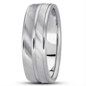 Two silver wedding bands with a brushed finish and diagonal engravings are stacked together.