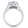 A diamond engagement ring with a large clear stone set in a silver band featuring smaller decorative stones along the sides.