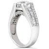 A silver ring features a large central diamond with smaller stones set along the band.