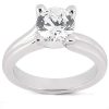 A silver ring features a large round diamond set in a four-prong setting.