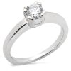 A silver engagement ring with a prominent single round diamond at the center.