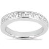 A silver ring featuring a row of clear, faceted stones along the band.