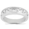 A silver band ring features a series of square-cut transparent stones set in a row.