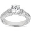 Silver engagement ring featuring a prominent round diamond at the center and smaller diamonds set into the band.