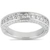 A silver ring with a row of sparkling clear stones set along its band.