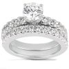 A diamond engagement ring featuring a large central stone and two rows of smaller diamonds on a white gold band.