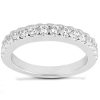 A silver ring featuring a row of evenly spaced clear gemstones along its top edge.