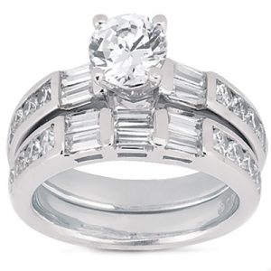 Two silver wedding bands, one featuring a round center diamond and the other with multiple rectangular diamonds, are displayed together.