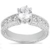 A silver engagement ring with a large center diamond surrounded by smaller diamonds on the band.