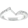 A silver ring with a wavy design features small, clear gemstones embedded along one side.
