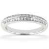 A diamond-studded silver band ring is displayed against a plain background.