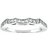 A silver ring with a wavy design is adorned with small sparkling stones along the top edge.