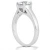 A silver engagement ring with a prominent round diamond is displayed at an angle.