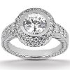 A silver ring features a large central diamond surrounded by smaller accent diamonds.