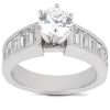 A silver ring with a large round center diamond and rectangular side diamonds.