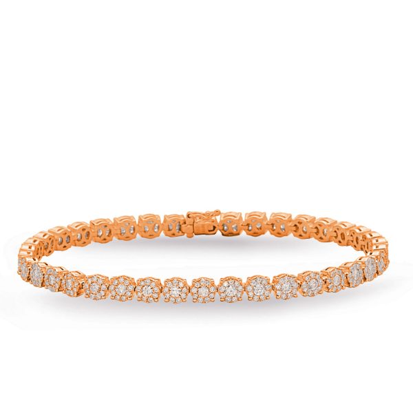 A rose gold bracelet with multiple sparkling diamond-like stones arranged in a circular pattern.