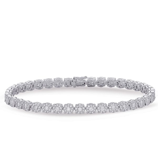 A diamond tennis bracelet made of interlocking silver links features multiple sparkling stones arranged in a symmetrical pattern.