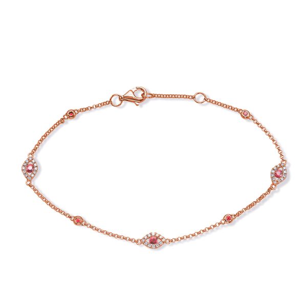 A rose gold bracelet with decorative elements featuring pink and clear stones is displayed.