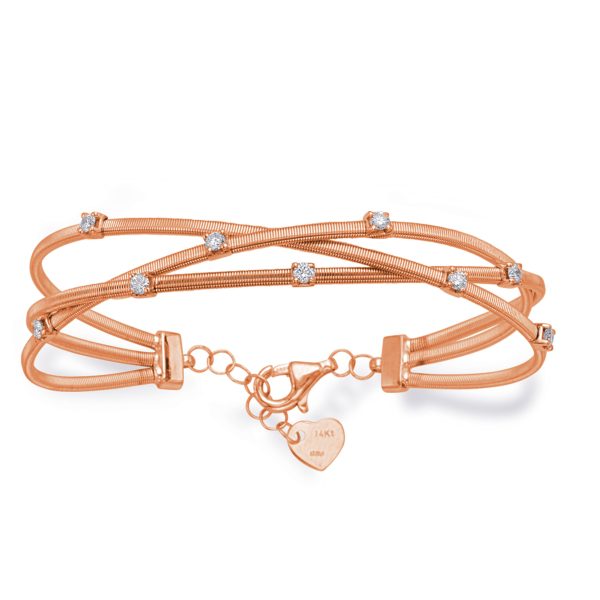 A three-stranded rose gold bracelet featuring small, clear decorative stones and a heart-shaped clasp.