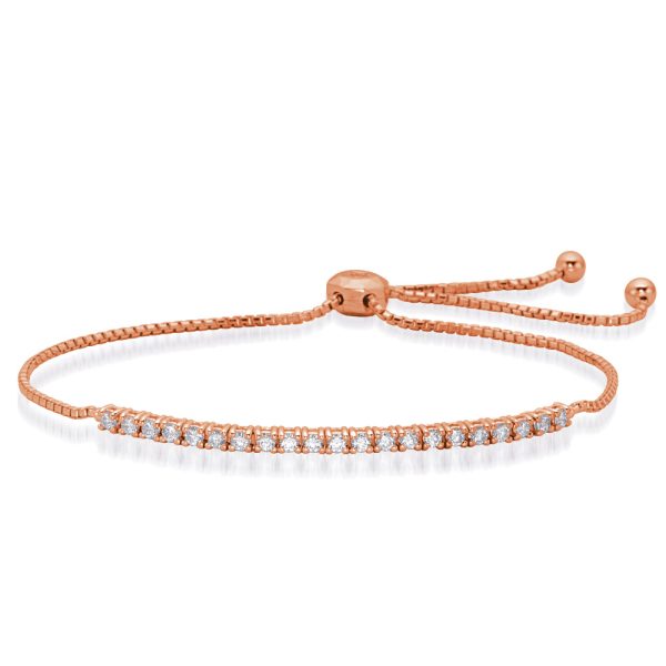 A rose gold bracelet with a row of sparkling gemstones and an adjustable clasp.
