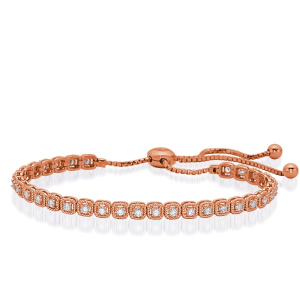 A rose gold bracelet featuring a row of clear gemstones and an adjustable sliding clasp.