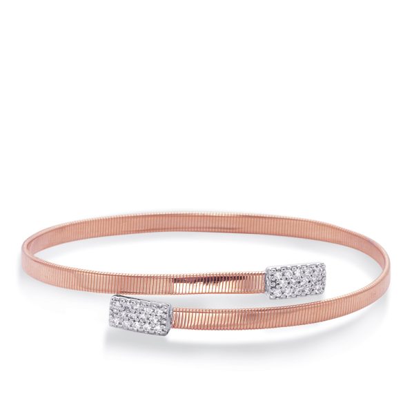 A rose gold hair ribbon features two silver ends adorned with small clear stones.