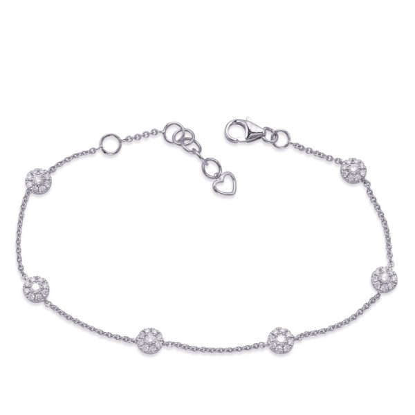 A silver bracelet with sparkling circular charms is displayed against a white background.