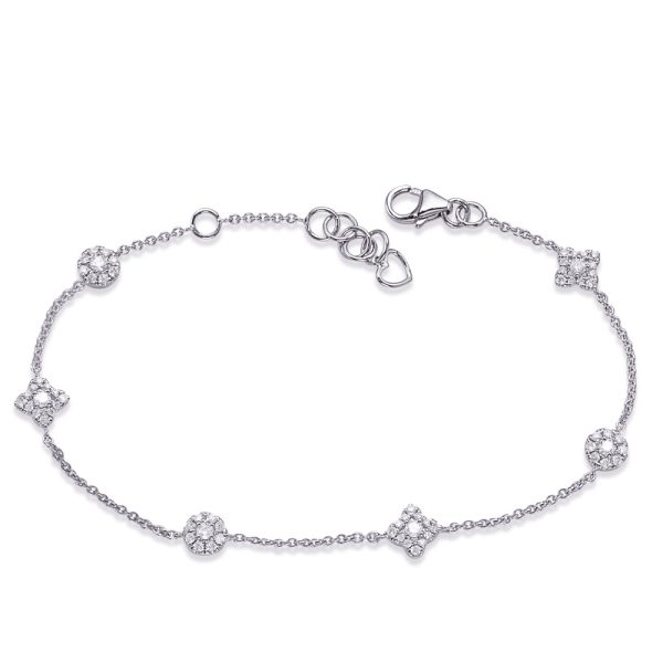 A silver chain bracelet adorned with sparkling round and square embellishments is displayed.