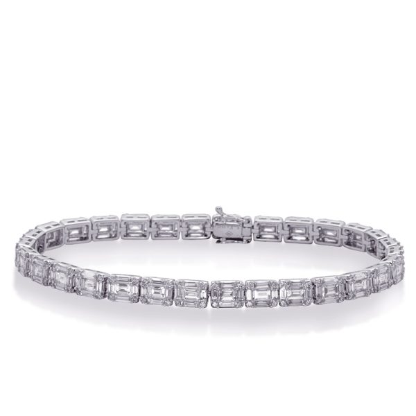 A shiny silver bracelet with rectangular gems is displayed against a white background.