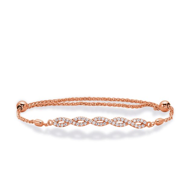A rose gold bracelet with a braided chain and gemstone accents is displayed against a plain background.