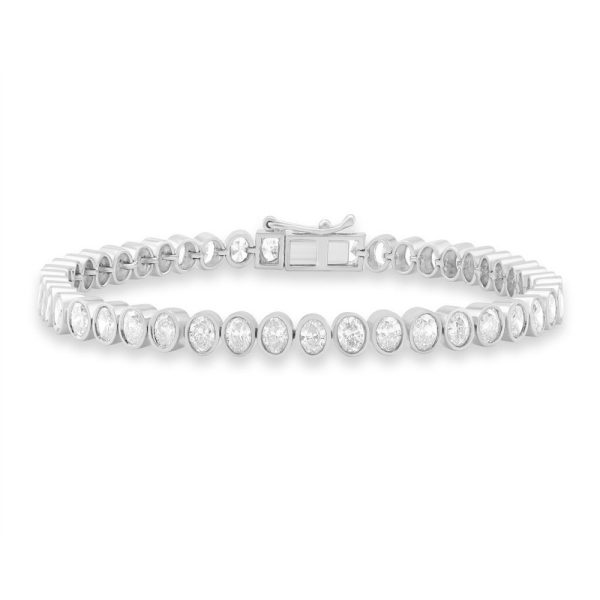 A silver bracelet featuring a series of oval-shaped, clear gemstones aligned along its length.