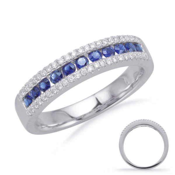 A silver ring featuring a row of blue gemstones and diamond accents.