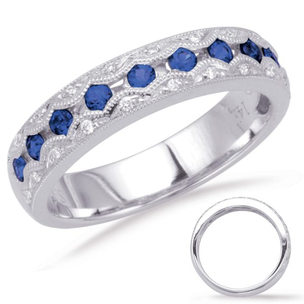 A silver ring with blue gemstones is displayed alongside a plain metal band.