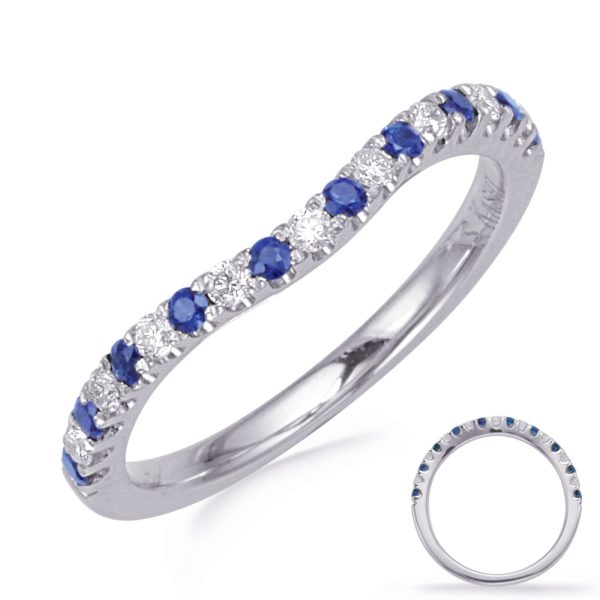 A sapphire and diamond band ring is displayed, showcasing alternating blue sapphires and white diamonds set in a silver band.