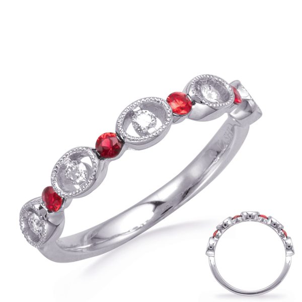 A silver ring featuring alternating red and clear gemstones set in oval and round shapes.