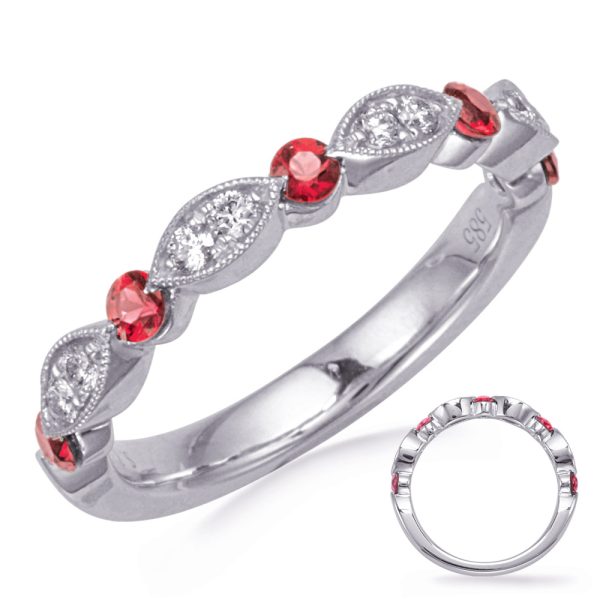 A silver ring featuring alternating red gemstones and clear diamonds set in a leaf-like design.