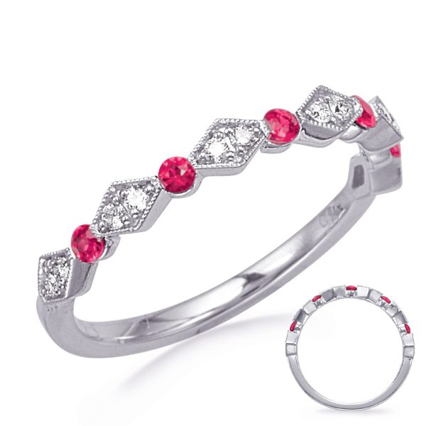 A silver ring with alternating red gemstones and diamond-like accents is displayed on a white background.