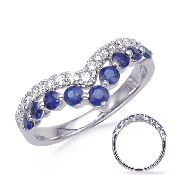 A silver ring featuring alternating blue and clear gemstones with a twisted design.