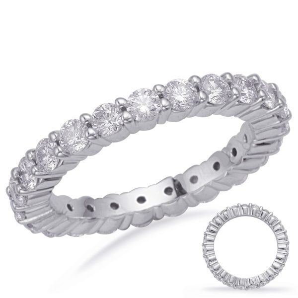 A silver ring is displayed with a row of round diamonds set around its band.