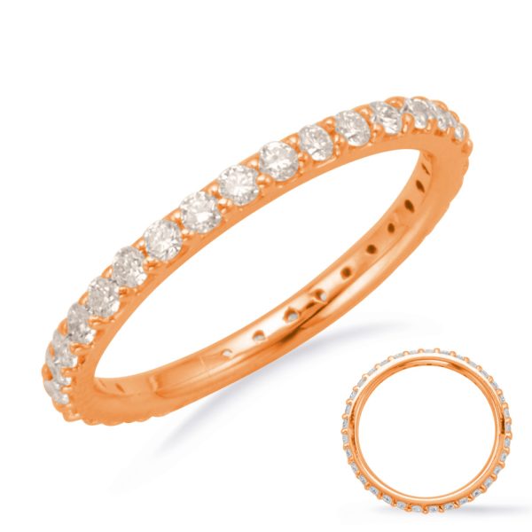 A rose gold ring adorned with a row of round diamonds is displayed prominently.
