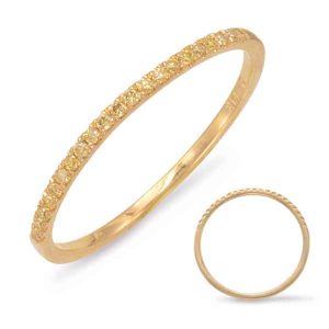 A gold ring with a textured surface and small gems is shown alongside a simpler, plain gold band.