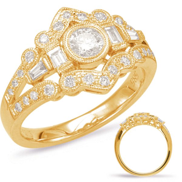 A gold ring with an intricate design features a central round diamond surrounded by smaller stones and a second ring displayed beside it.