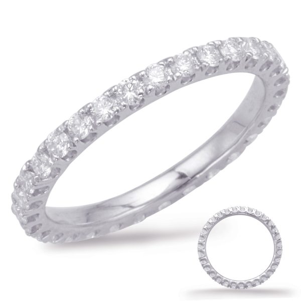 A silver ring is displayed with a row of clear gemstones around its circumference.