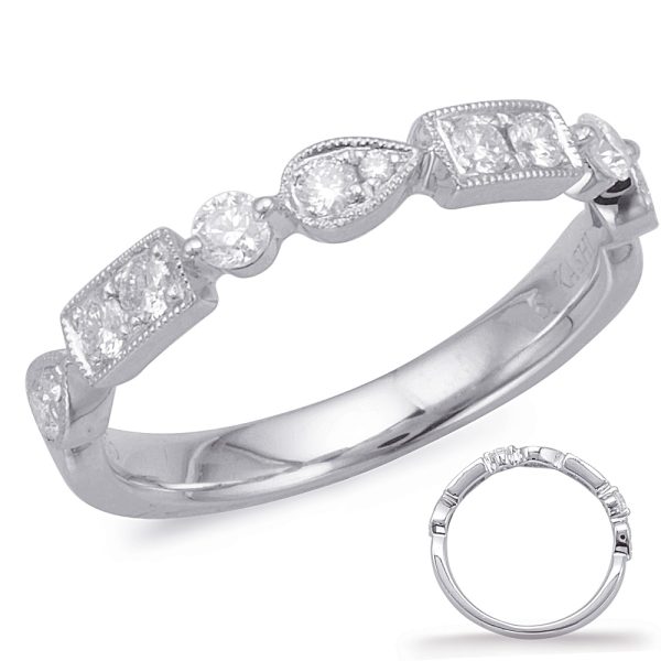 A white gold ring with alternating diamond shapes and a polished band is displayed prominently.