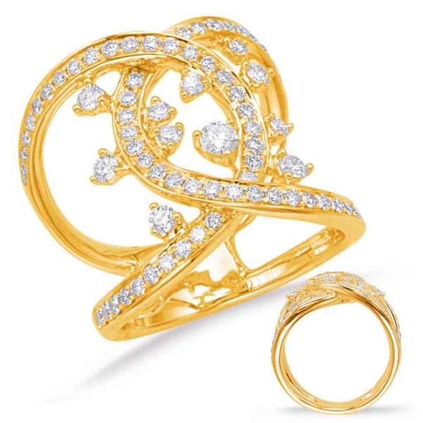 Gold ring with a decorative swirling design embellished with small diamonds.