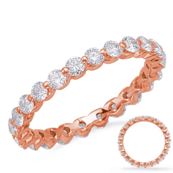 A rose gold ring featuring a continuous row of round brilliant cut diamonds.
