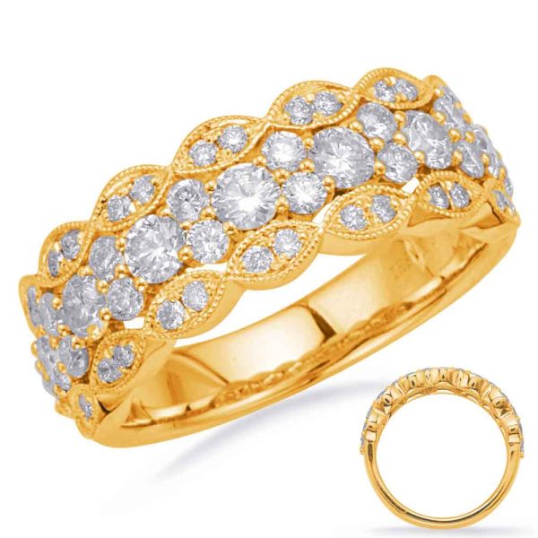 A golden ring adorned with multiple sparkling round diamonds is displayed, showcasing its intricate scalloped design.