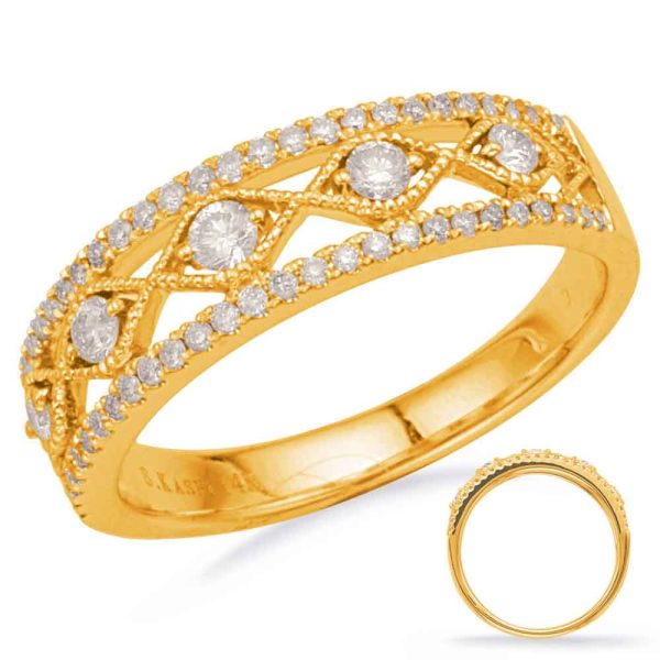 A gold ring with a decorative pattern features multiple round diamonds set in a textured band.