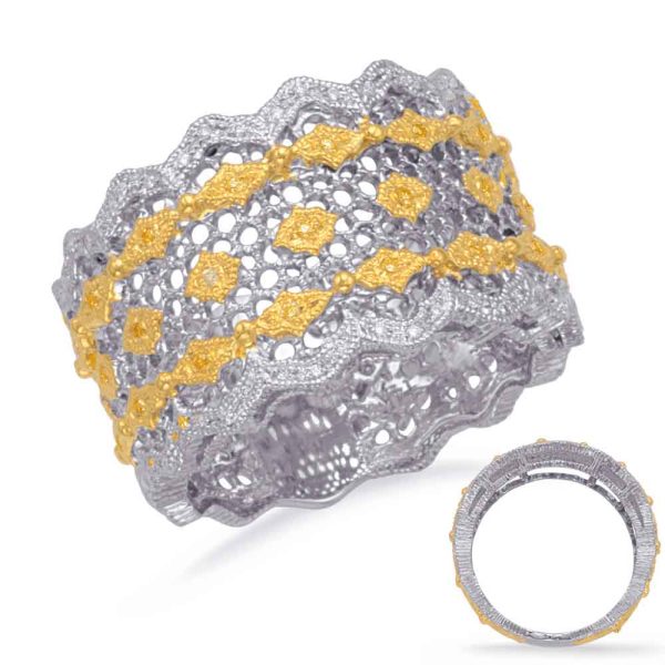 Intricately designed silver and gold bracelet featuring a lace-like pattern with wavy edges and geometric accents.