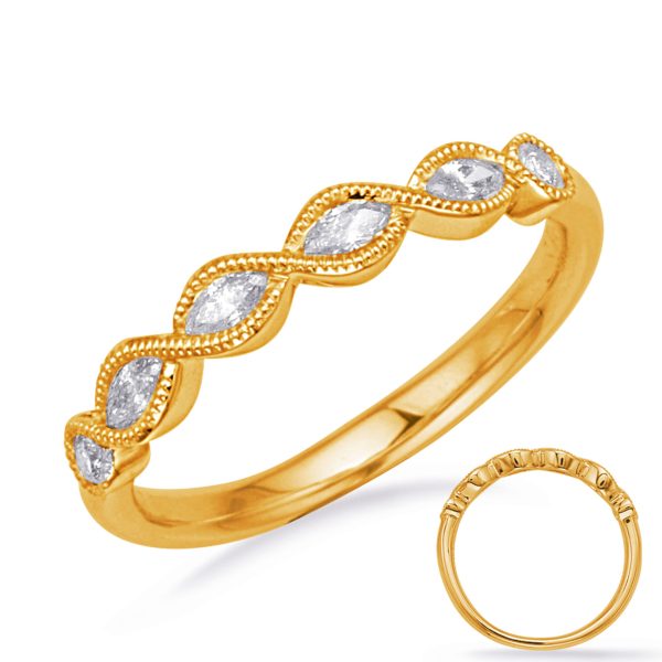 A gold ring with interlinked marquise-shaped stones is displayed against a plain background.